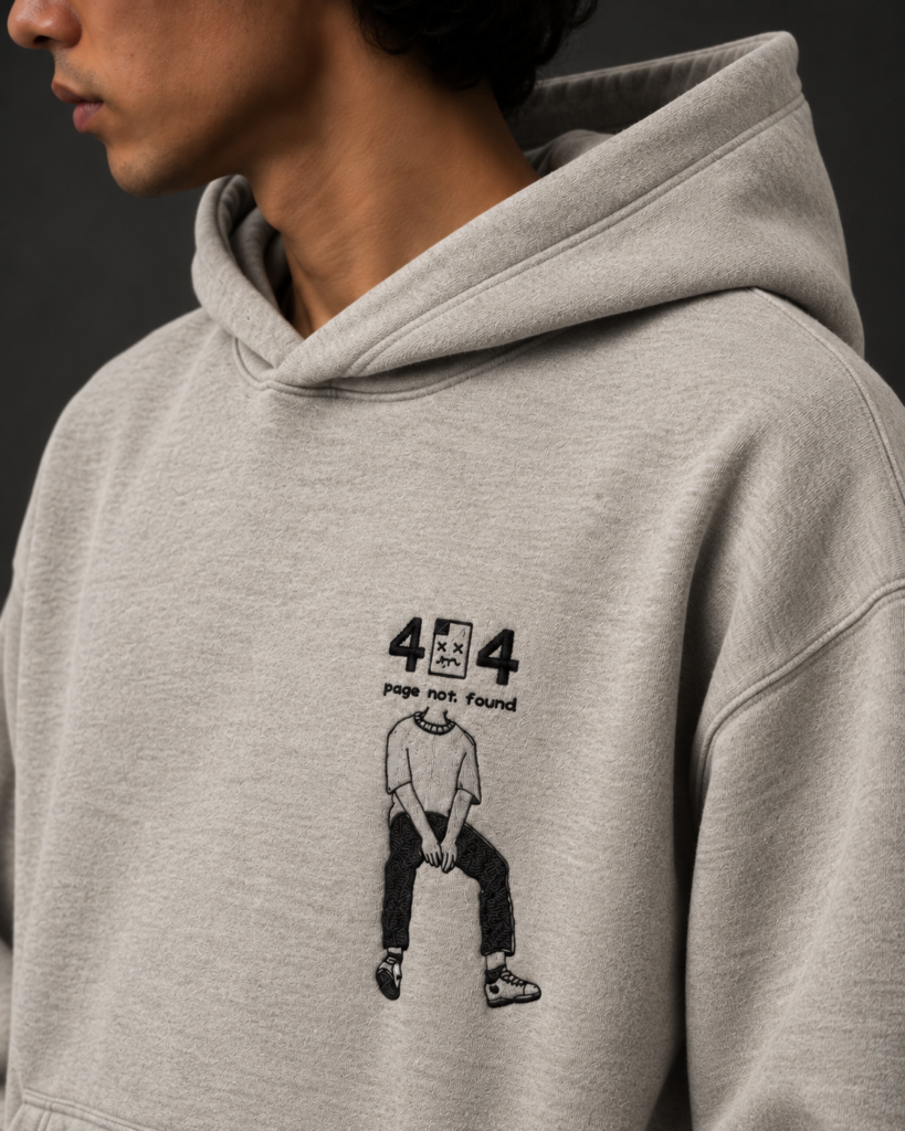 404 page not found embroidery design closeup on grey hoodie