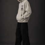 Ombrellia oversized hoodie side angle styled with black cargo pants