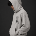 Ombrellia oatmeal grey hoodie hood up side profile